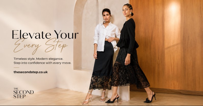 Woman wearing a black lace midi skirt with a white blouse and classic heels.