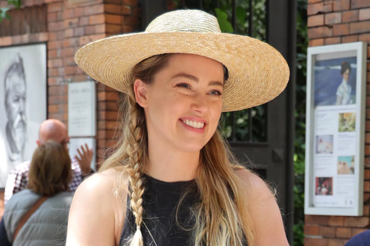 Amber Heard actress smiling in a public photo