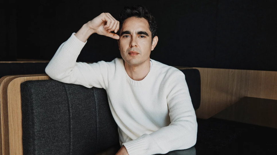 Max Minghella actor and director smiling at a public event